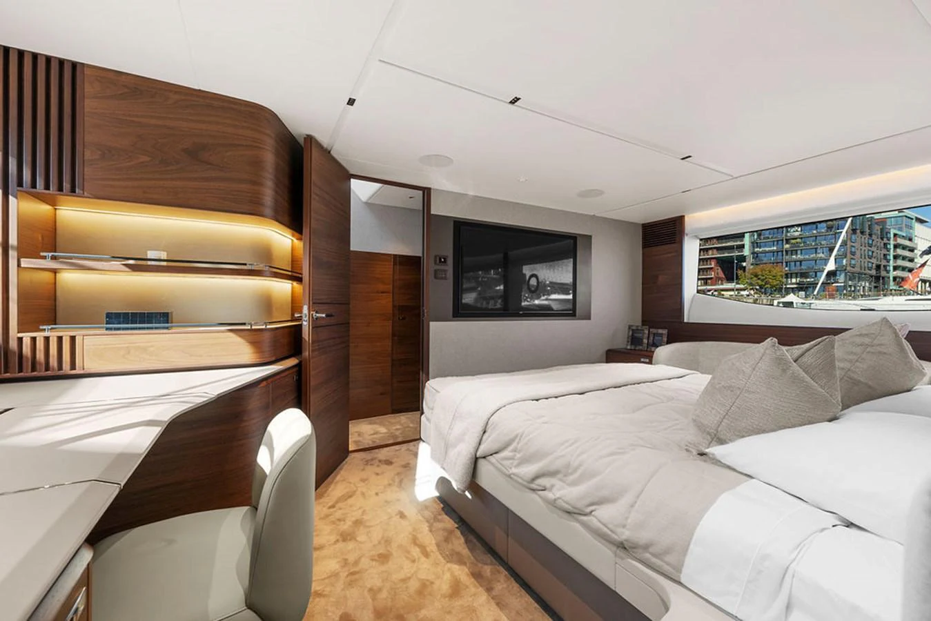 The stateroom features a luxurious bed, modern furnishings, and ample natural light. aboard PRINCESS S72 Yacht for Sale
