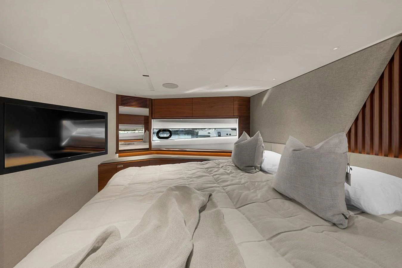 The stateroom features a plush bed with elegant bedding and modern amenities for ultimate comfort. aboard PRINCESS S72 Yacht for Sale