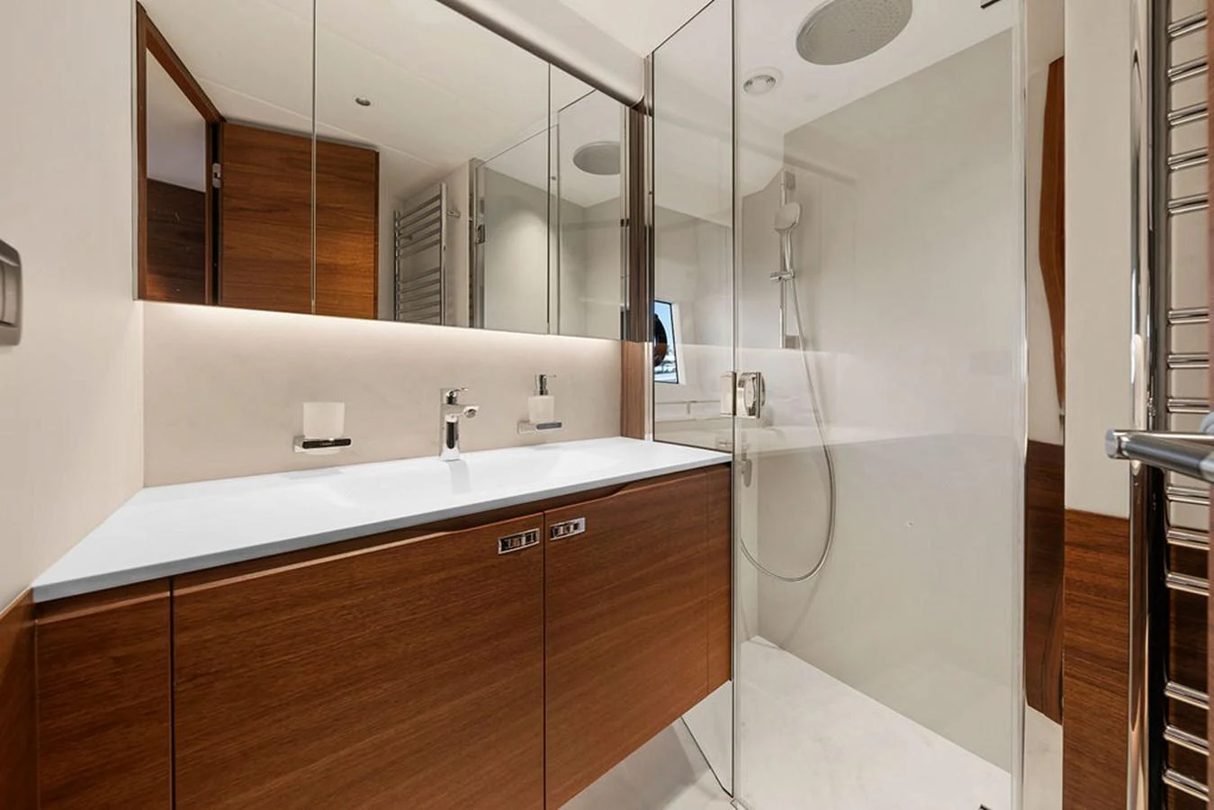 The yacht's bathroom features a sleek design with modern fixtures and ample storage. aboard PRINCESS S72 Yacht for Sale