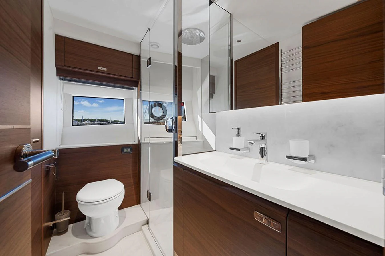 The yacht's bathroom features modern fixtures and a sleek design with wooden accents. aboard PRINCESS S72 Yacht for Sale