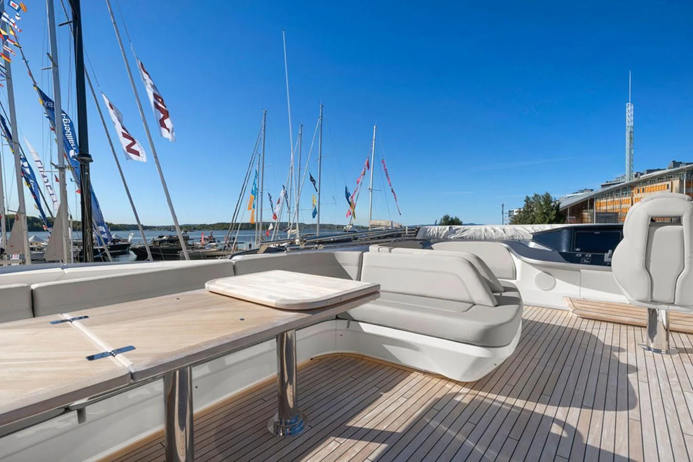 The flybridge offers a spacious seating area with a table, perfect for enjoying the views. aboard PRINCESS S72 Yacht for Sale
