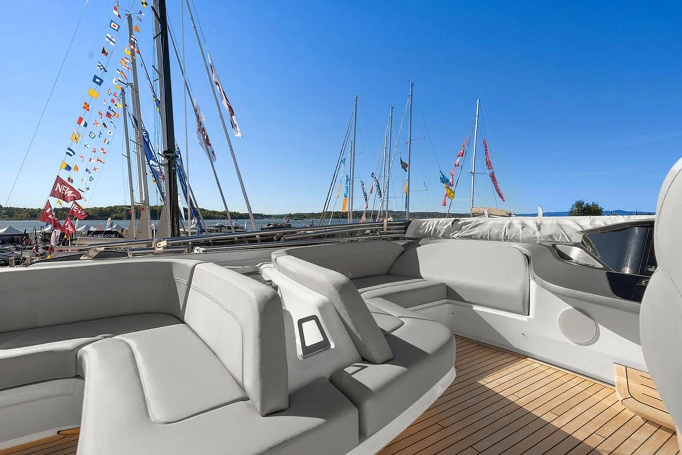 The yacht's aft deck features comfortable seating with a view of the marina and surrounding boats. aboard PRINCESS S72 Yacht for Sale