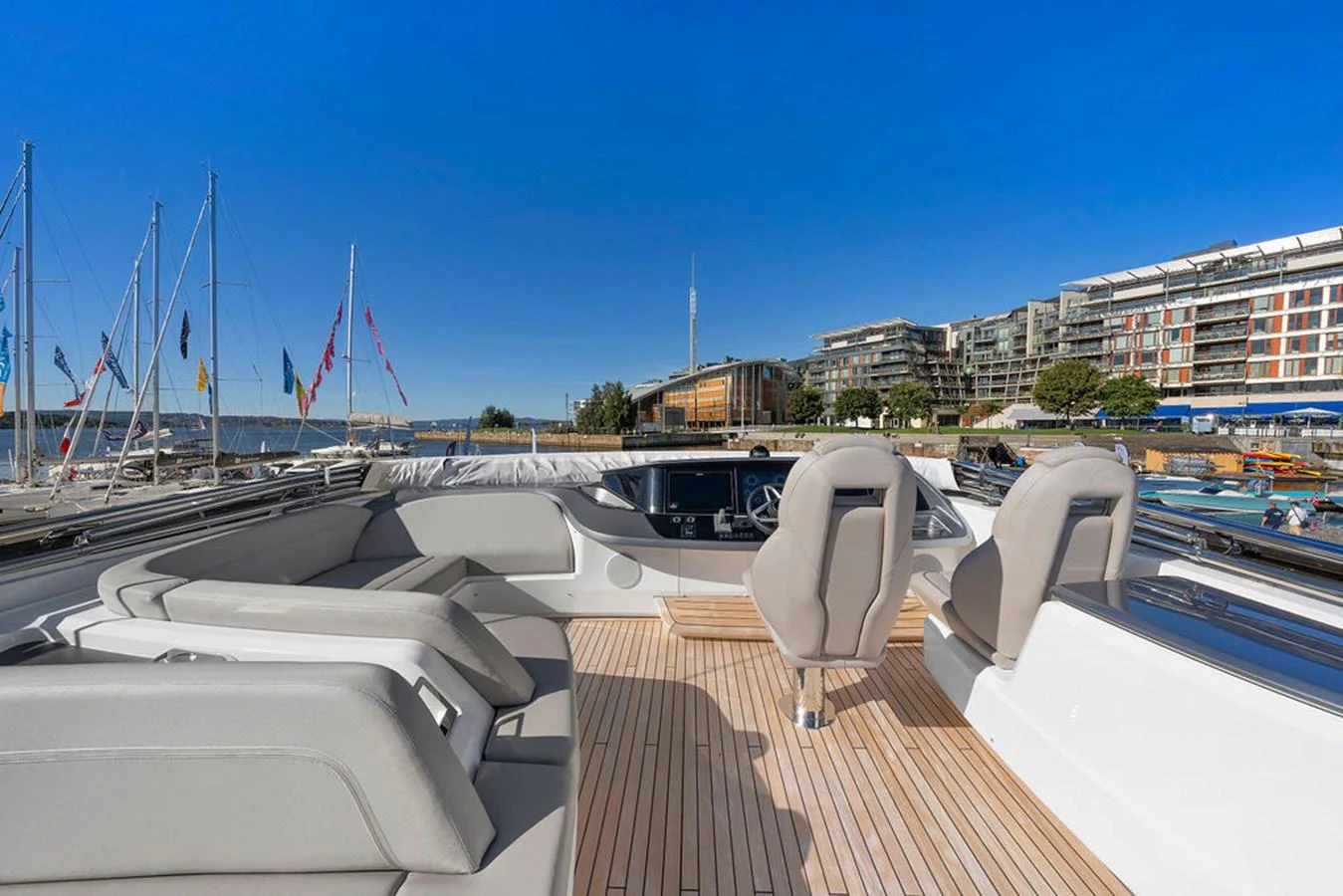 The yacht's flybridge offers a spacious and luxurious area for relaxation and navigation, with comfortable seating and a stunning view of the marina. aboard PRINCESS S72 Yacht for Sale