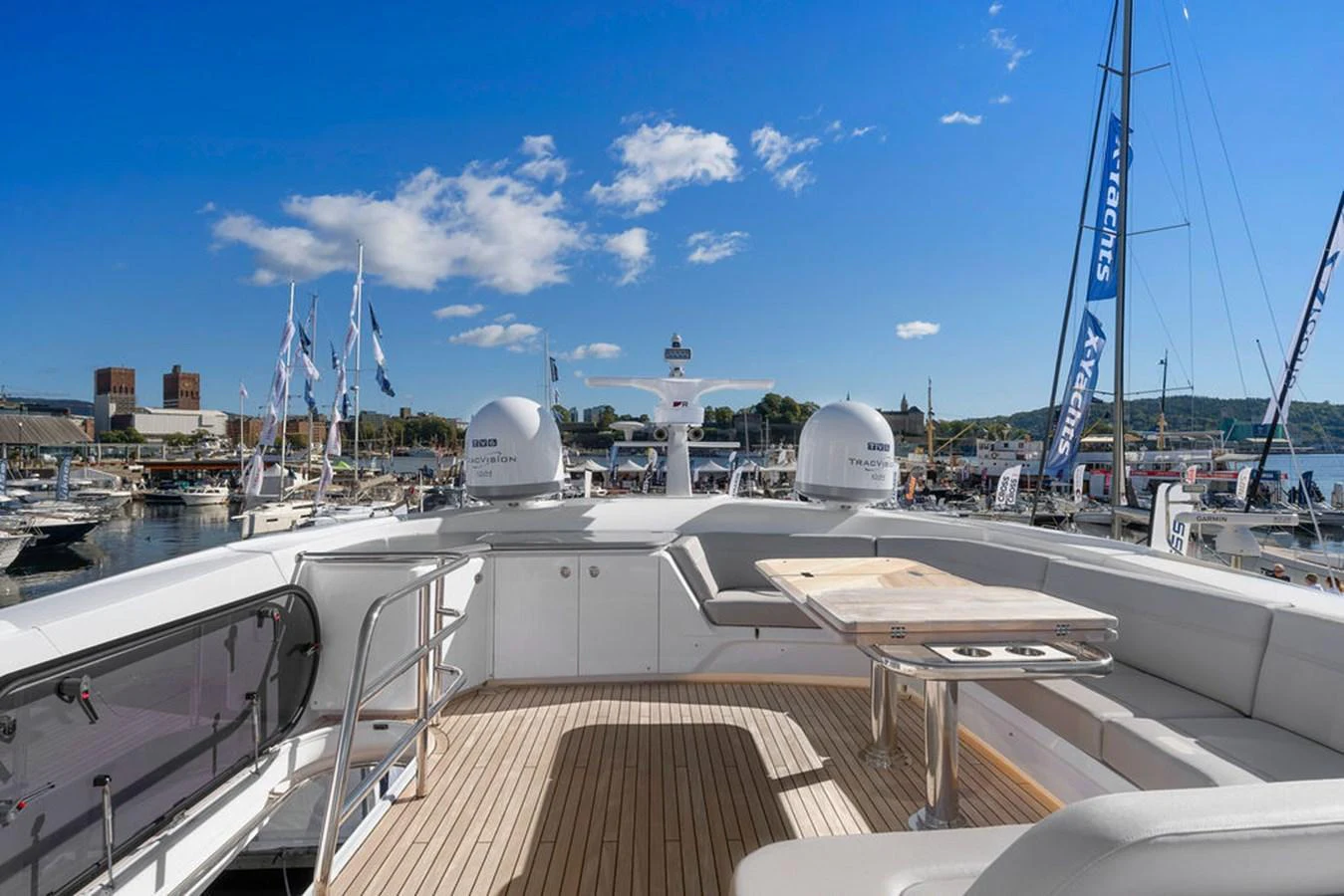 The flybridge offers a spacious and inviting area for relaxation and entertainment with a stunning view of the marina. aboard PRINCESS S72 Yacht for Sale