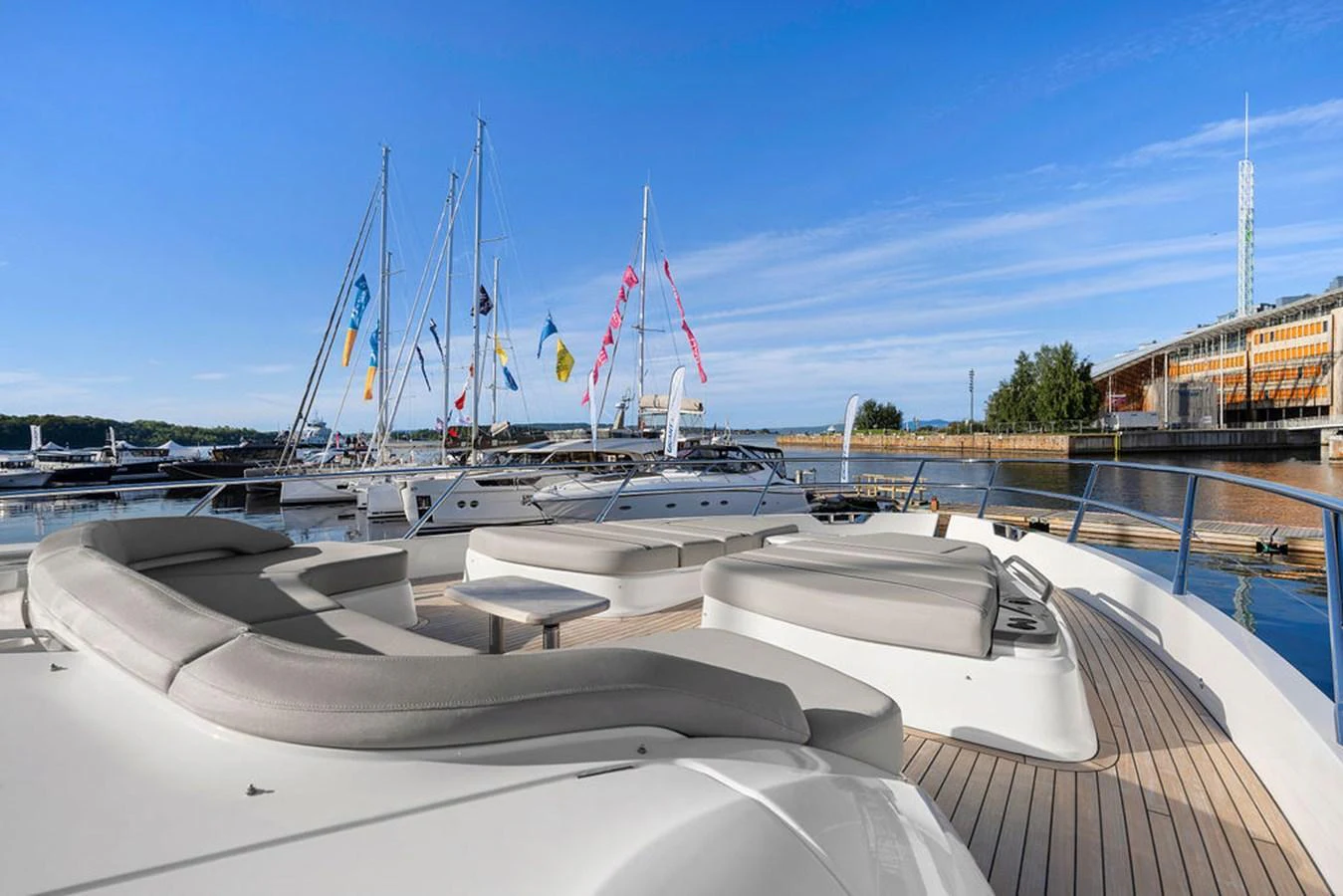 The sundeck offers a spacious and inviting area for relaxation with comfortable seating and a beautiful view of the marina. aboard PRINCESS S72 Yacht for Sale