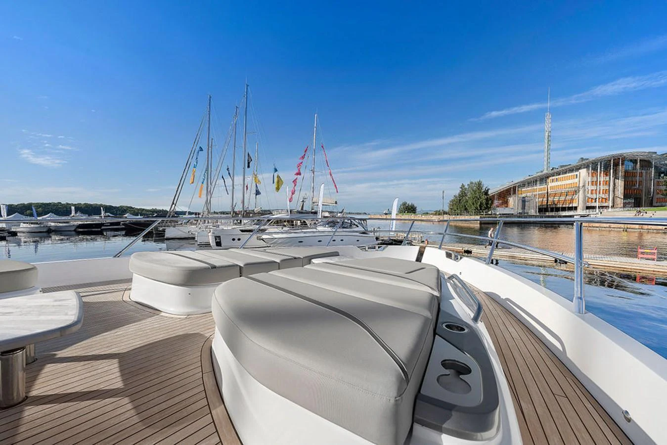 The foredeck features spacious sunpads with a scenic marina backdrop. aboard PRINCESS S72 Yacht for Sale