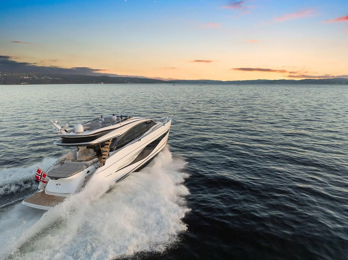 A sleek yacht cruises through calm waters at sunset, showcasing its elegant design and powerful performance. aboard PRINCESS S72 Yacht for Sale