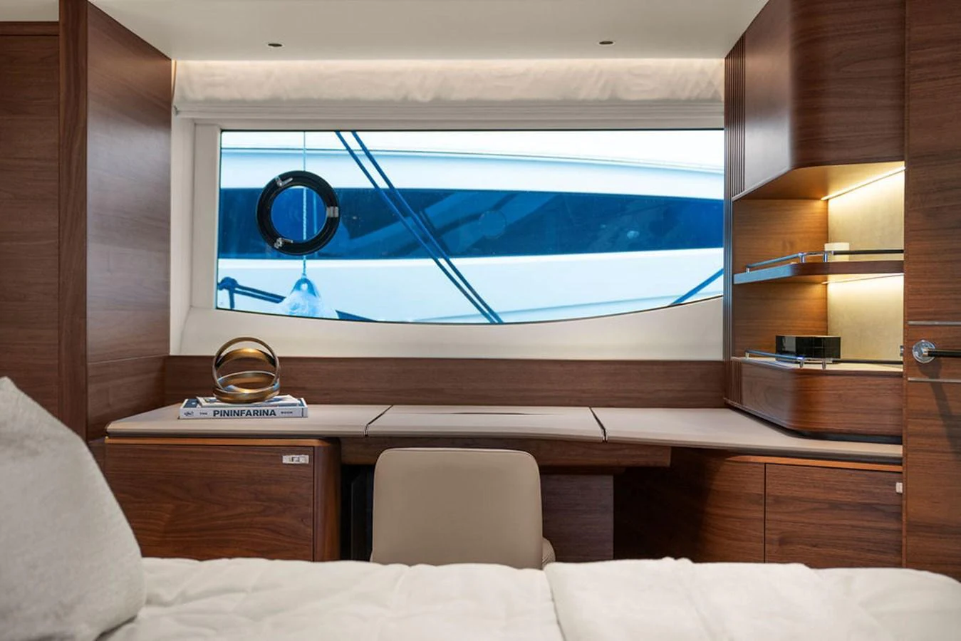 The stateroom features a sleek desk area with a large window offering a view of the yacht's exterior. aboard PRINCESS S72 Yacht for Sale