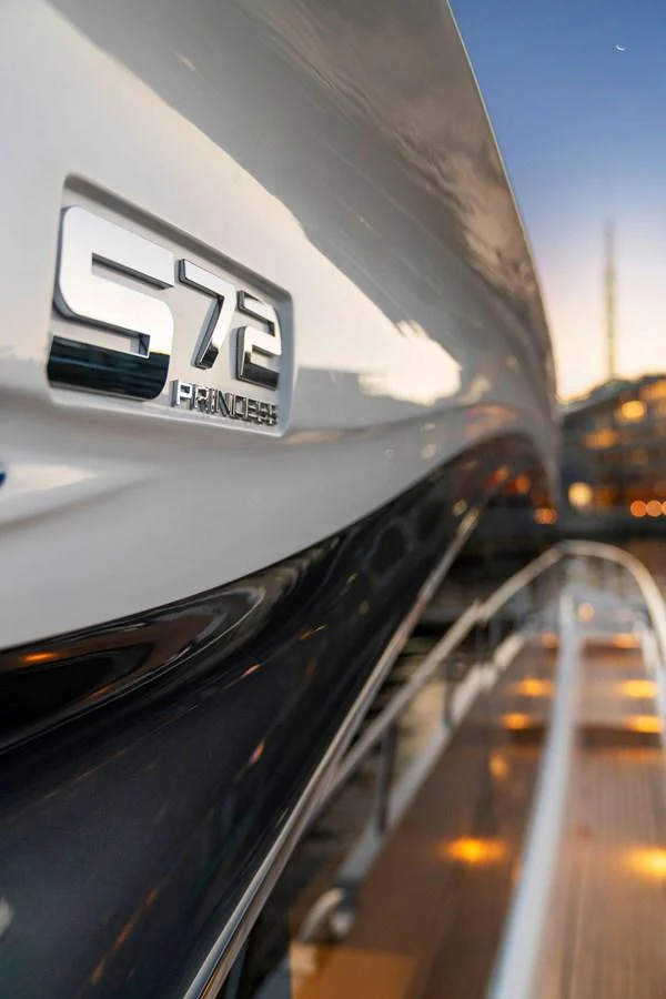 A close-up view of the yacht's sleek exterior with the model number prominently displayed. aboard PRINCESS S72 Yacht for Sale