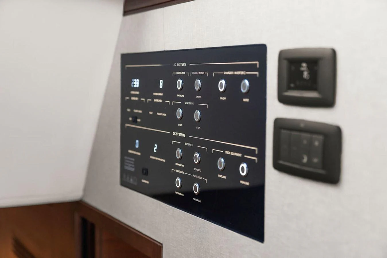 A close-up view of the yacht's control panel showcasing various switches and indicators. aboard PRINCESS S72 Yacht for Sale