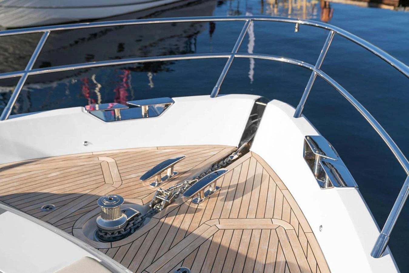 The bow of the yacht features polished stainless steel fittings and a teak deck. aboard PRINCESS S72 Yacht for Sale