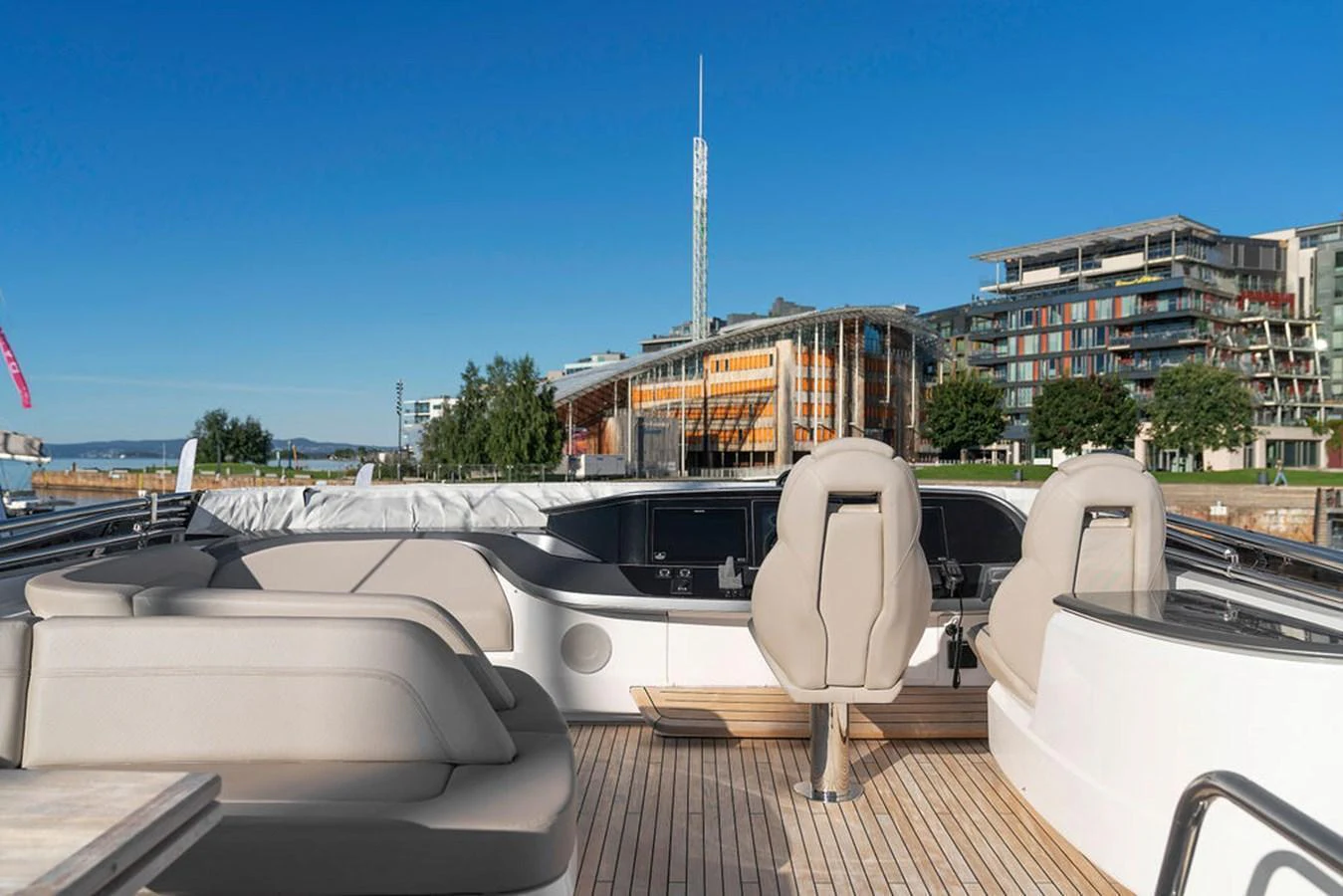 The flybridge offers a spacious seating area with modern, comfortable chairs and a beautiful view of the surroundings. aboard PRINCESS S72 Yacht for Sale