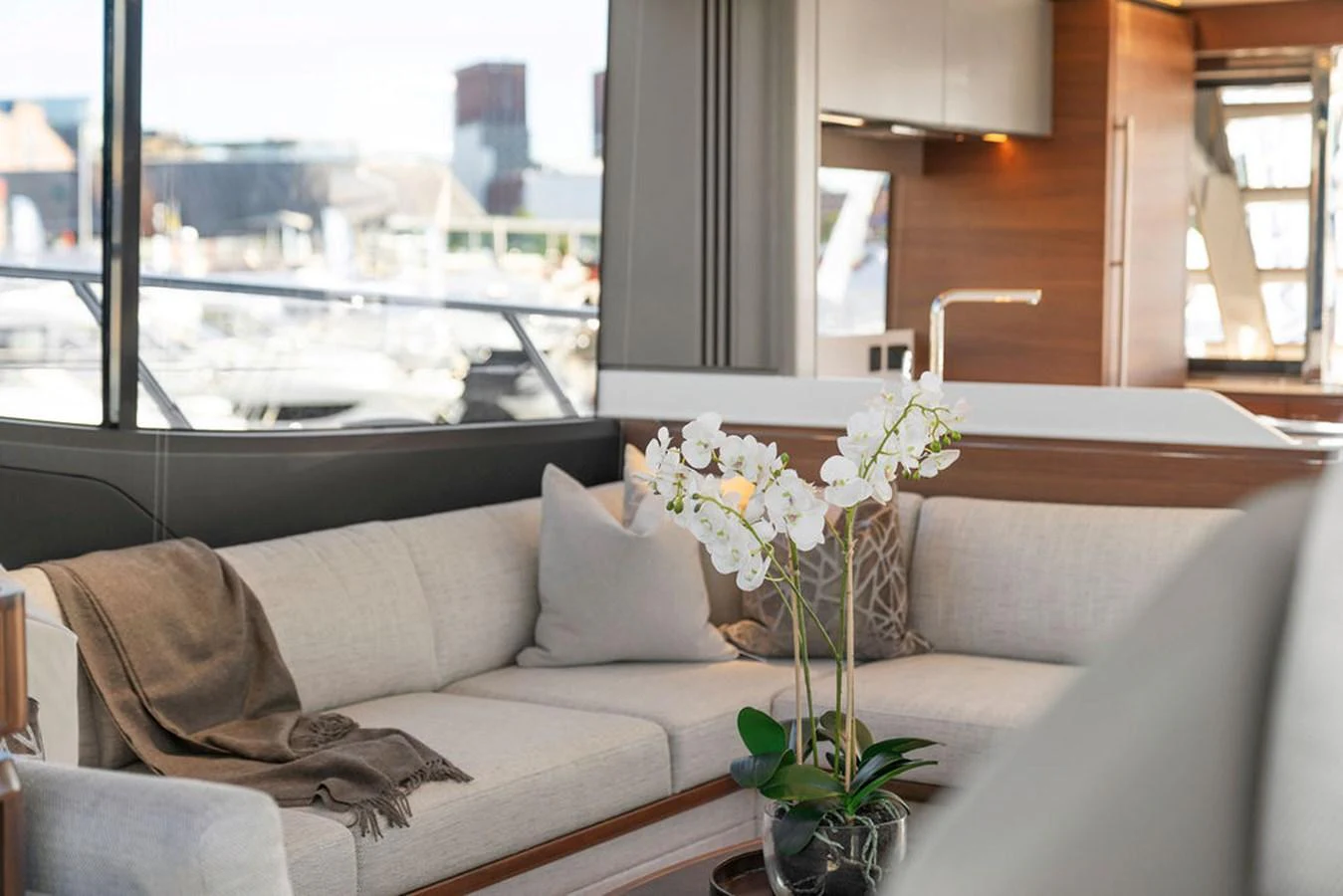 The salon features a comfortable seating area with a modern, elegant design and large windows for natural light. aboard PRINCESS S72 Yacht for Sale