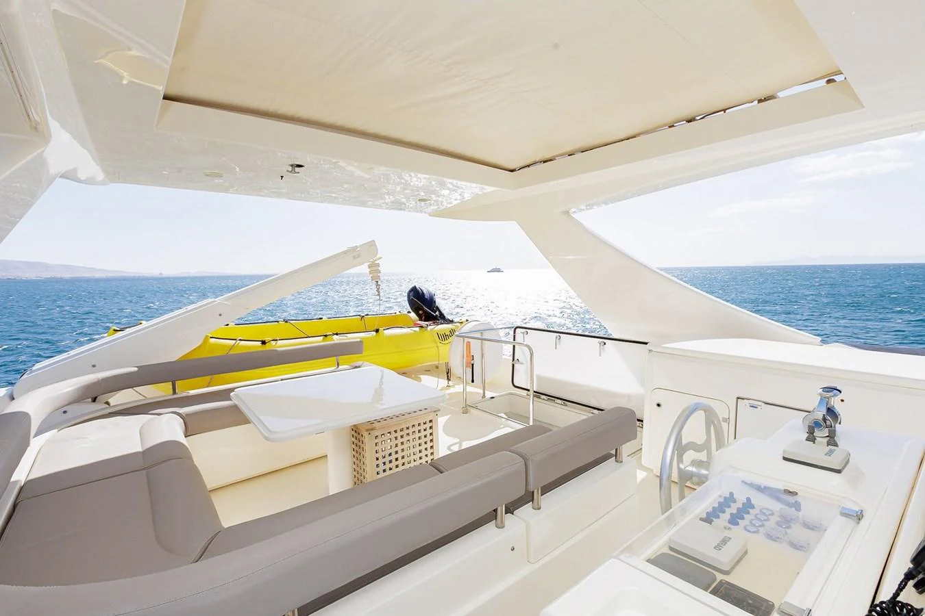 The flybridge offers a spacious and luxurious area with comfortable seating and stunning ocean views. aboard M/Y EM- II Yacht for Sale