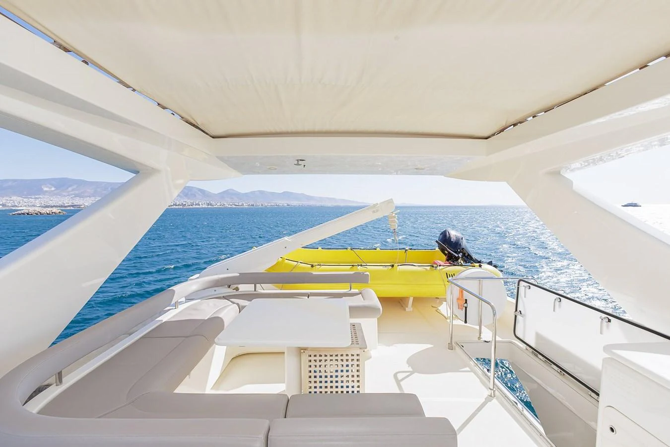 The aft deck offers a spacious and comfortable seating area with a stunning view of the sea. aboard M/Y EM- II Yacht for Sale