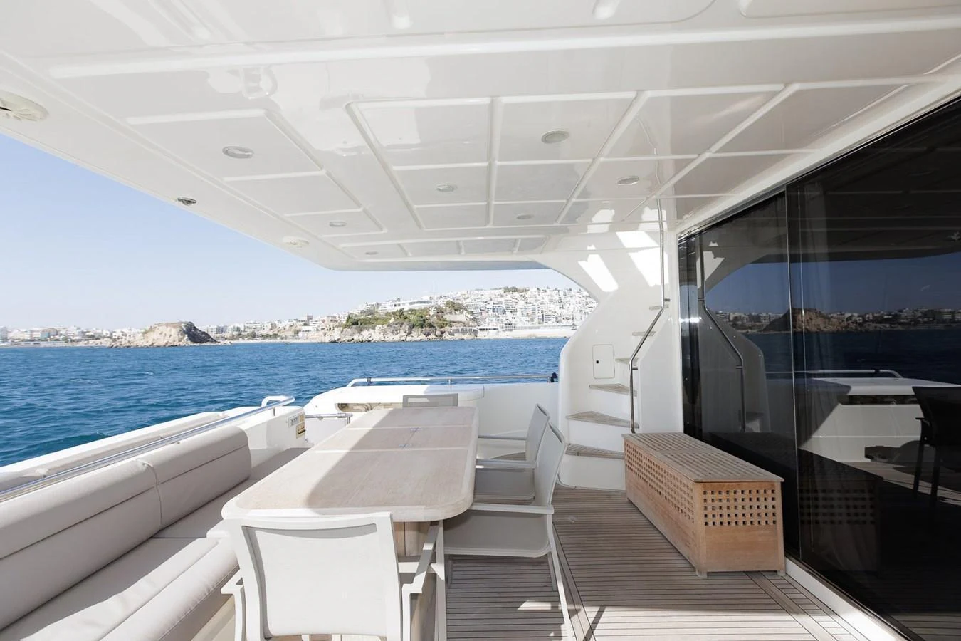 The aft deck offers a spacious and elegant outdoor dining area with stunning sea views. aboard M/Y EM- II Yacht for Sale