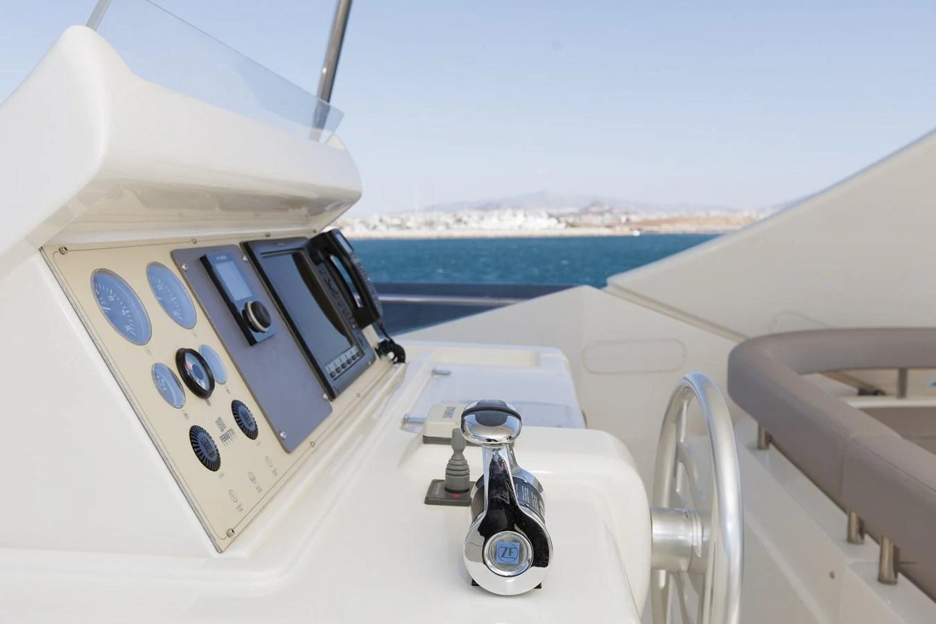 The helm station features modern navigation instruments and a sleek design. aboard M/Y EM- II Yacht for Sale