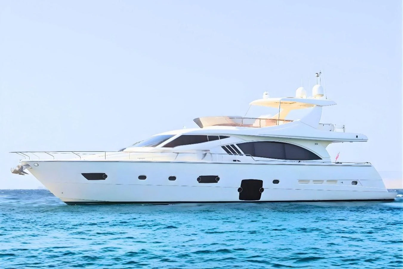 A sleek and modern yacht glides gracefully on the calm blue waters. aboard M/Y EM- II Yacht for Sale