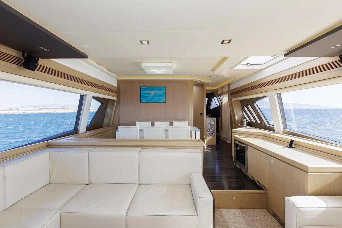 The yacht's salon features a spacious and modern design with ample natural light and comfortable seating. aboard M/Y EM- II Yacht for Sale