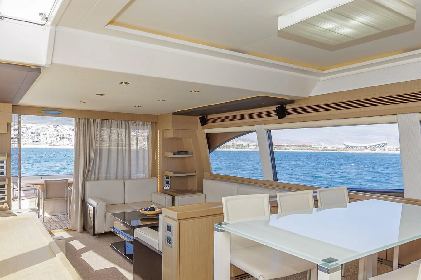 The yacht's salon offers a spacious and bright area with modern furnishings and large windows providing stunning sea views. aboard M/Y EM- II Yacht for Sale