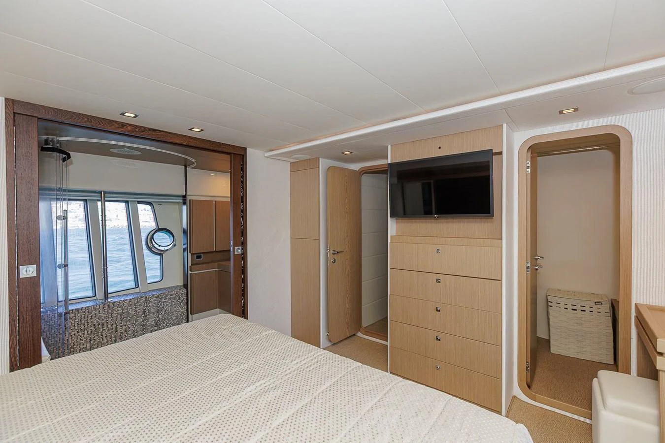 The stateroom features a comfortable bed, ample storage, and a flat-screen TV, creating a cozy and functional space. aboard M/Y EM- II Yacht for Sale