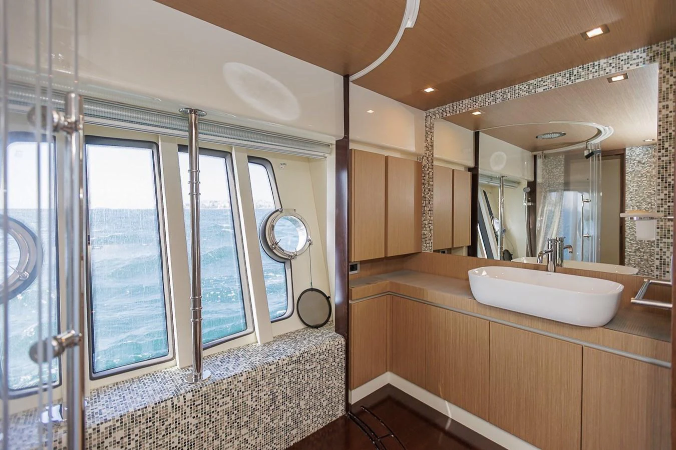 The yacht's bathroom features modern fixtures and large windows with a view of the sea. aboard M/Y EM- II Yacht for Sale