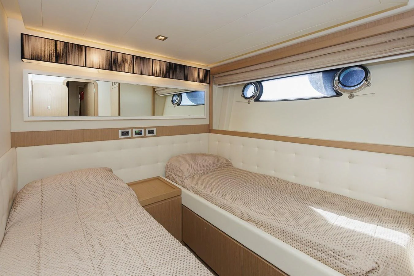 The twin stateroom offers a cozy and elegant sleeping arrangement with modern finishes and ample natural light. aboard M/Y EM- II Yacht for Sale