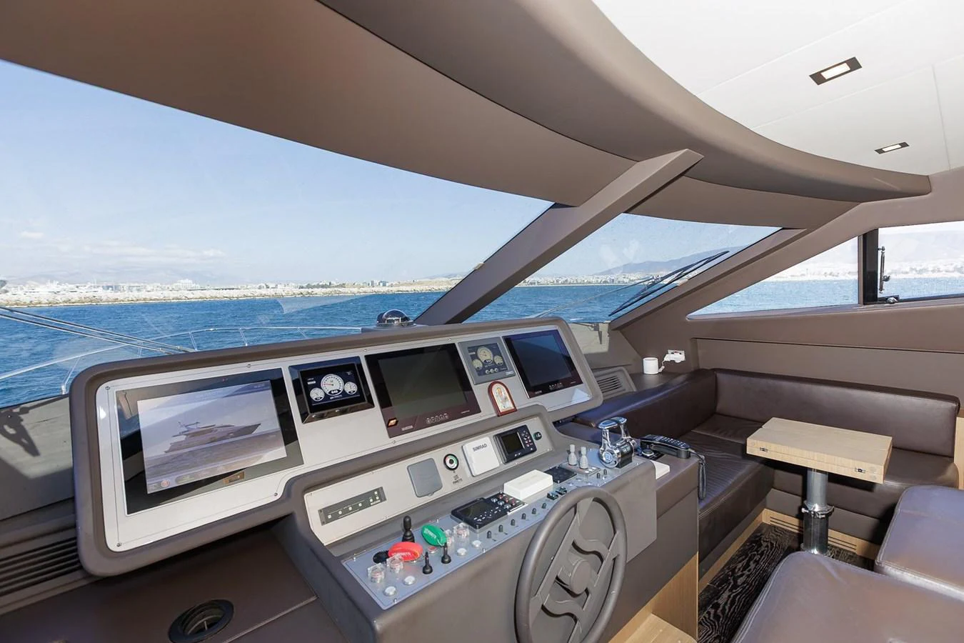 The helm station offers a modern and well-equipped command center with panoramic views. aboard M/Y EM- II Yacht for Sale