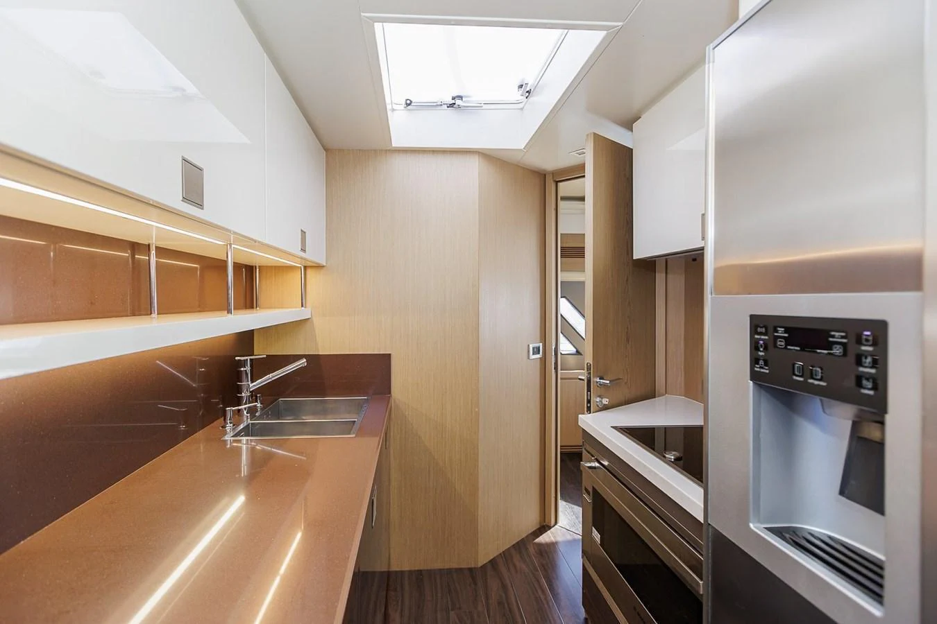 The yacht's galley features modern appliances and a sleek design, perfect for gourmet meal preparation. aboard M/Y EM- II Yacht for Sale
