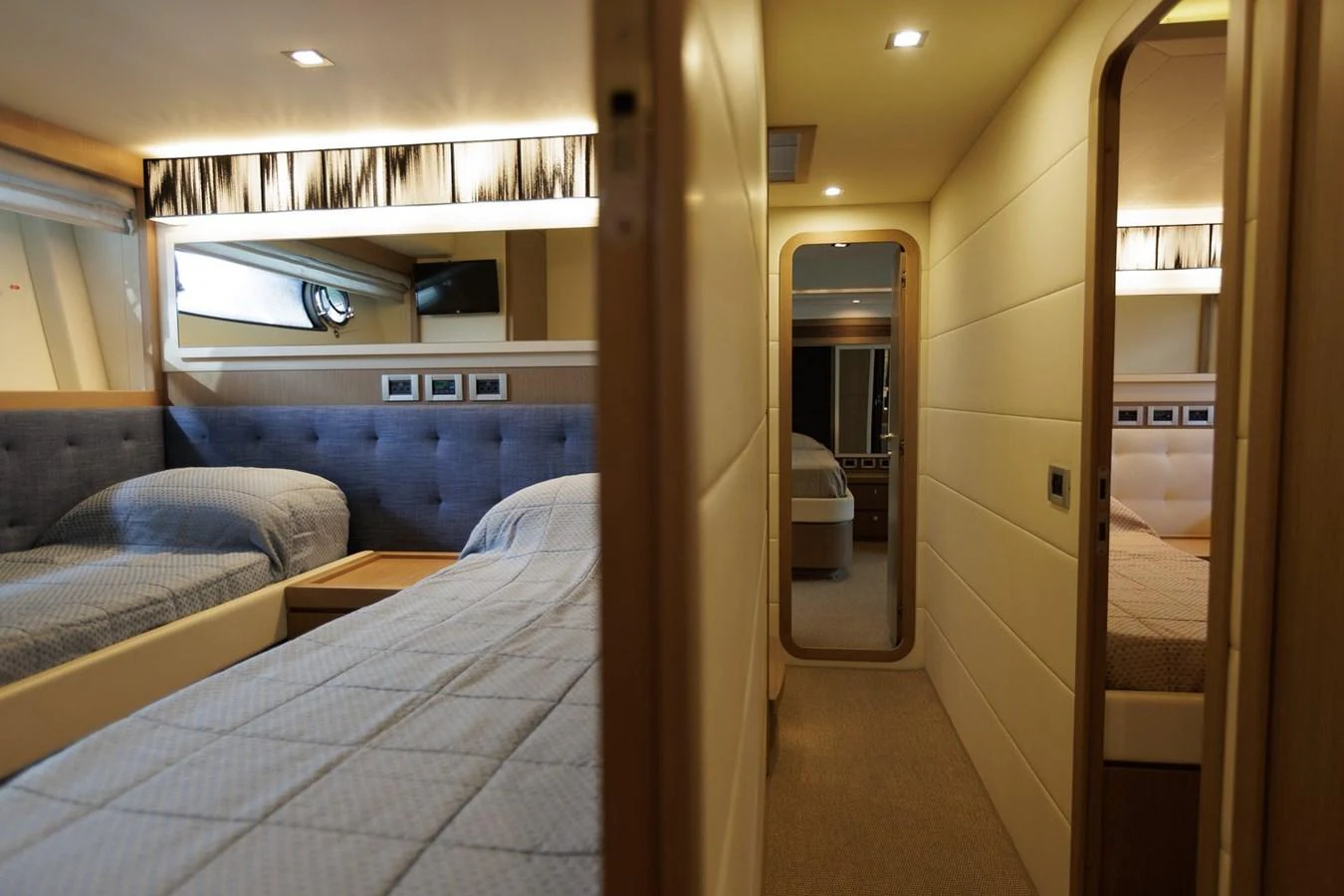 The guest stateroom features twin beds with plush bedding and modern lighting. aboard M/Y EM- II Yacht for Sale