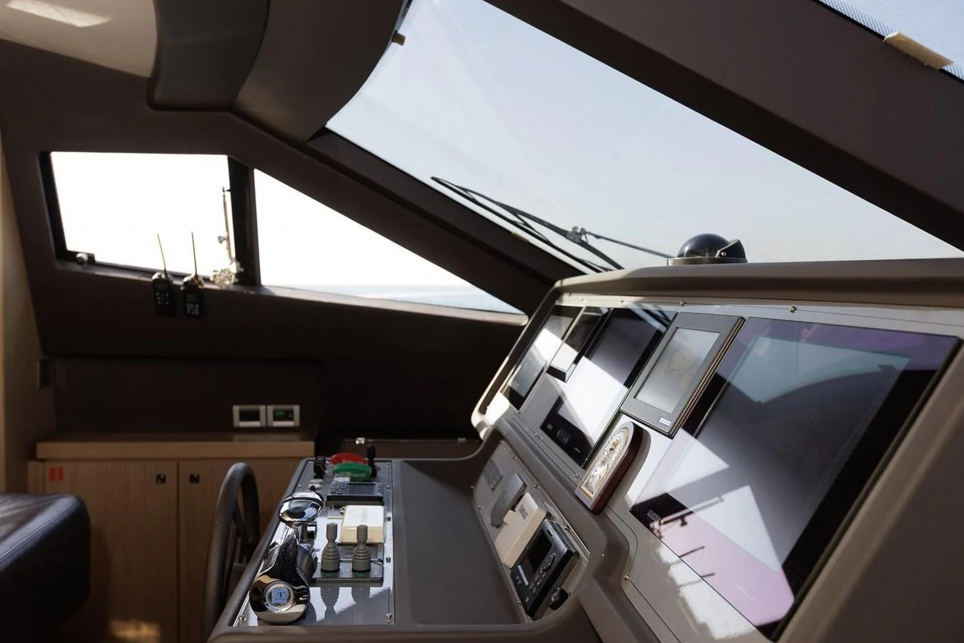 The helm station features advanced navigation equipment and a sleek, modern design. aboard M/Y EM- II Yacht for Sale