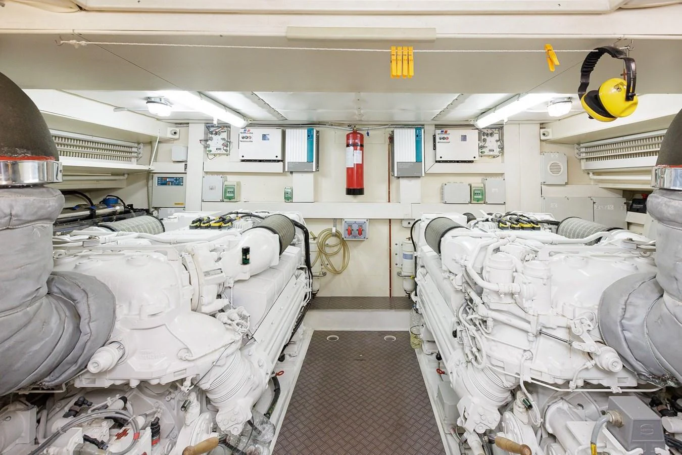 The engine room showcases powerful twin engines and meticulous organization. aboard M/Y EM- II Yacht for Sale
