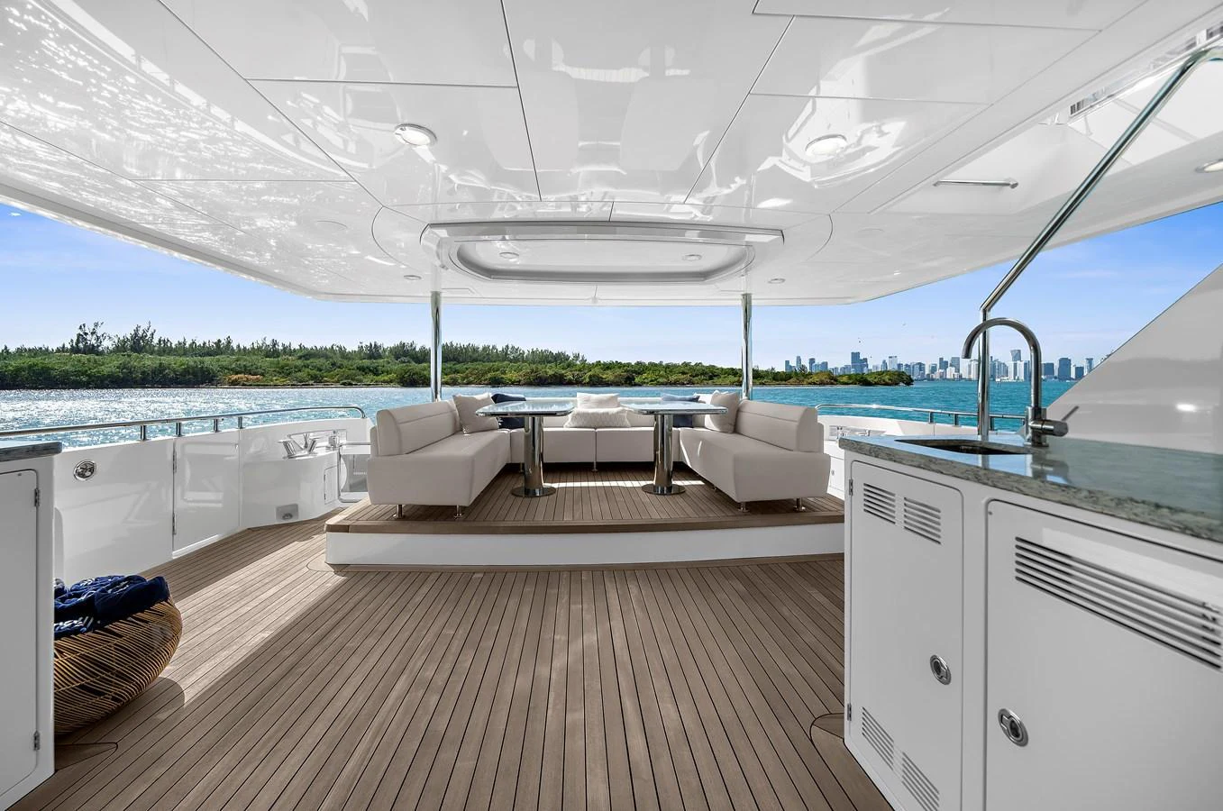 The aft deck offers a spacious and elegant outdoor seating area with stunning views. aboard LA LA LA Yacht for Sale