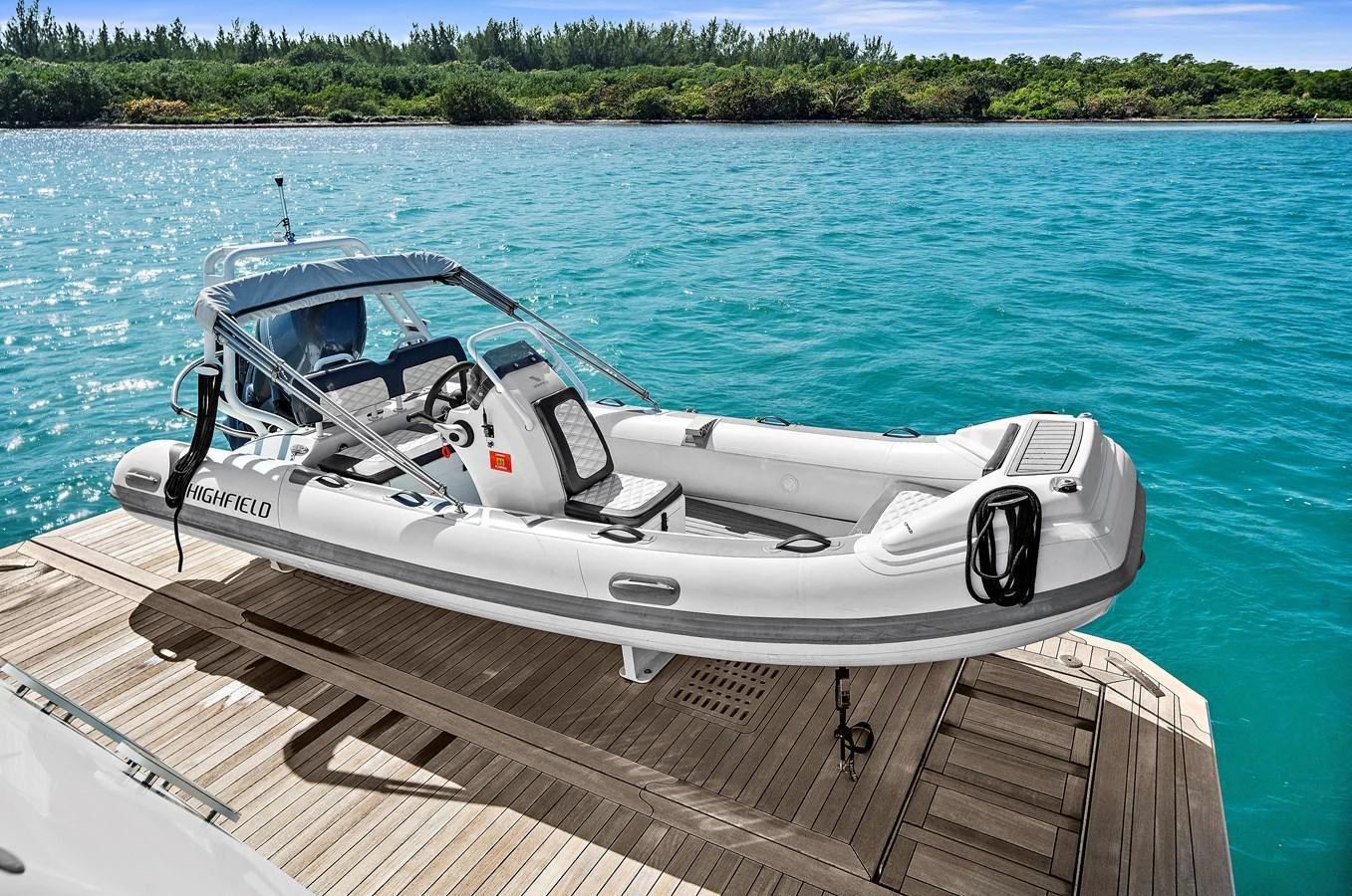 A sleek tender is positioned on the swim platform, ready for excursions. aboard LA LA LA Yacht for Sale