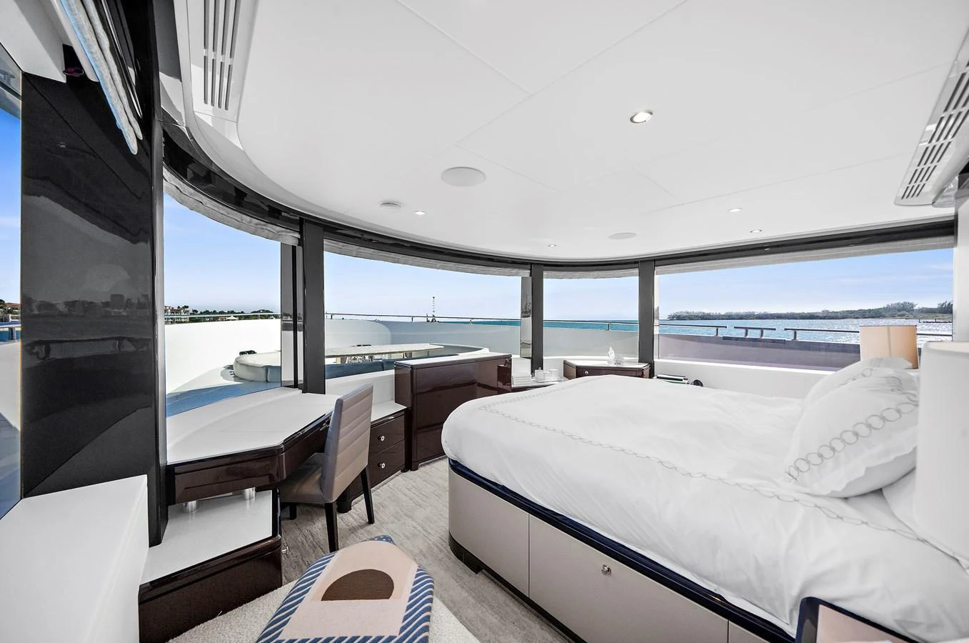 The master stateroom offers panoramic views and luxurious comfort with modern furnishings. aboard LA LA LA Yacht for Sale