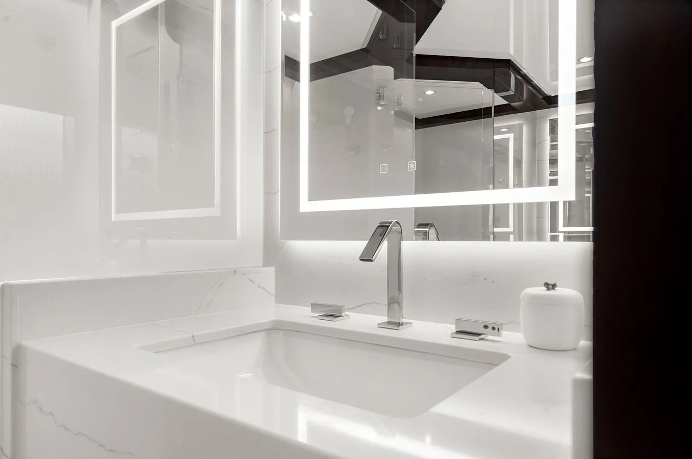 The yacht's bathroom features a sleek, modern design with a minimalist aesthetic. aboard LA LA LA Yacht for Sale