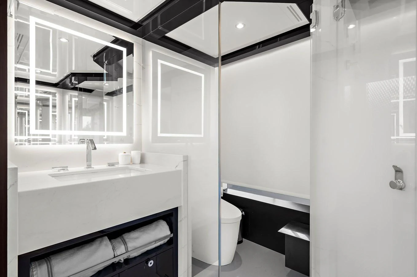 The yacht's bathroom features a modern design with sleek fixtures and ample lighting. aboard LA LA LA Yacht for Sale