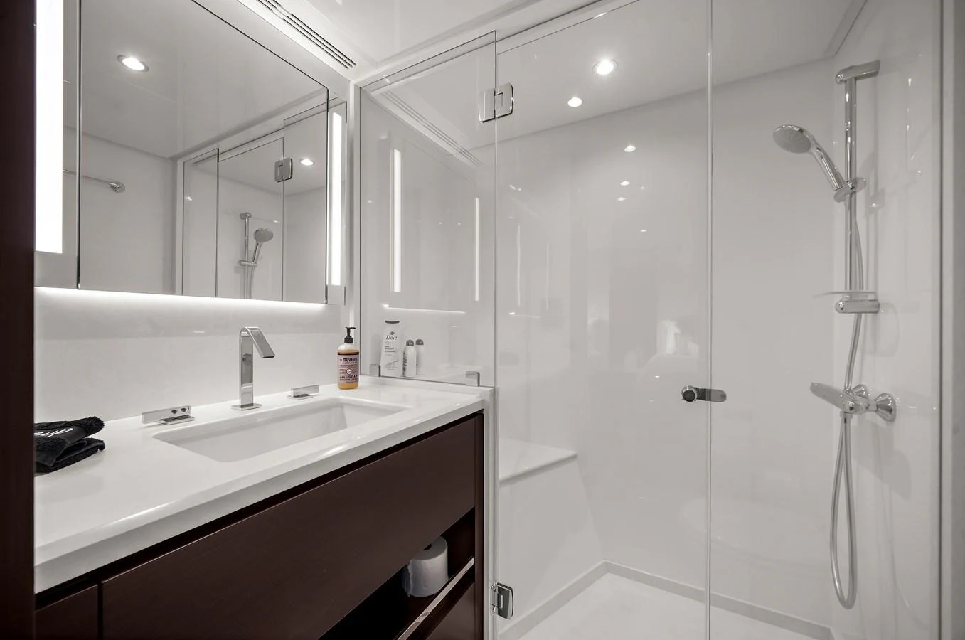 A sleek and modern yacht bathroom featuring a spacious shower and elegant fixtures. aboard LA LA LA Yacht for Sale