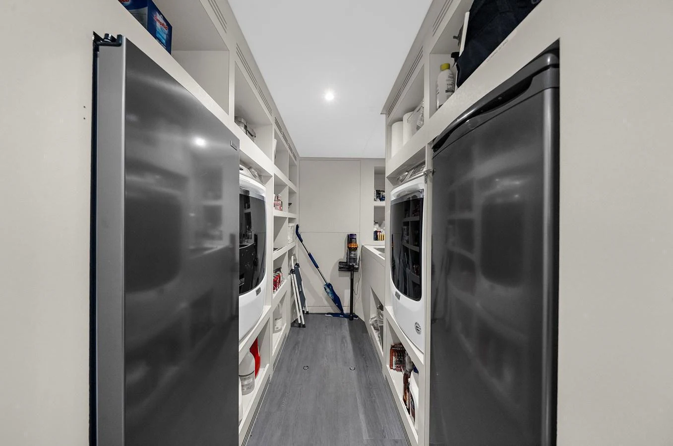 The yacht's laundry room is equipped with modern appliances and ample storage space. aboard LA LA LA Yacht for Sale