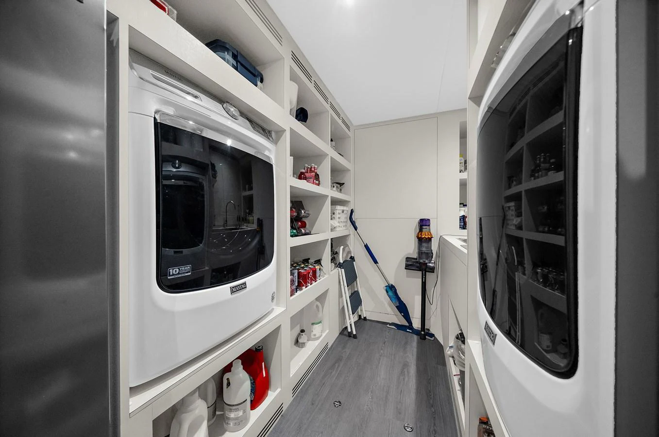 The yacht's laundry room is equipped with modern appliances and ample storage space. aboard LA LA LA Yacht for Sale