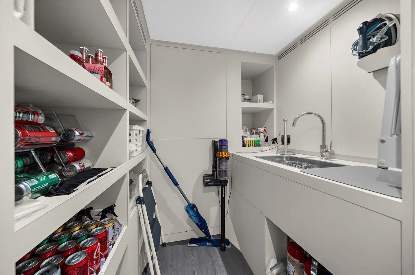 The yacht's utility room is well-organized with ample storage and modern amenities. aboard LA LA LA Yacht for Sale