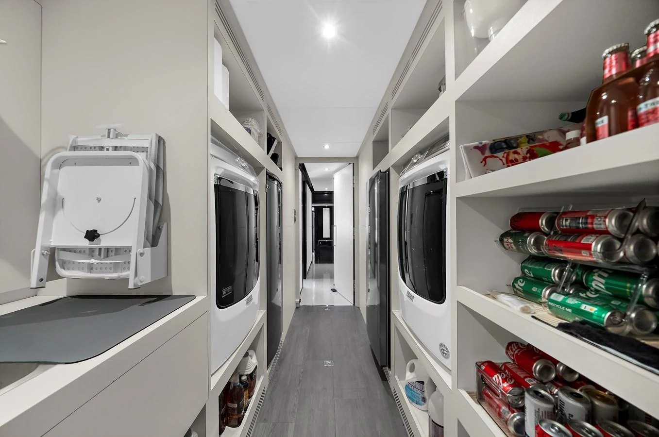The yacht features a well-organized laundry room with modern appliances and ample storage space. aboard LA LA LA Yacht for Sale