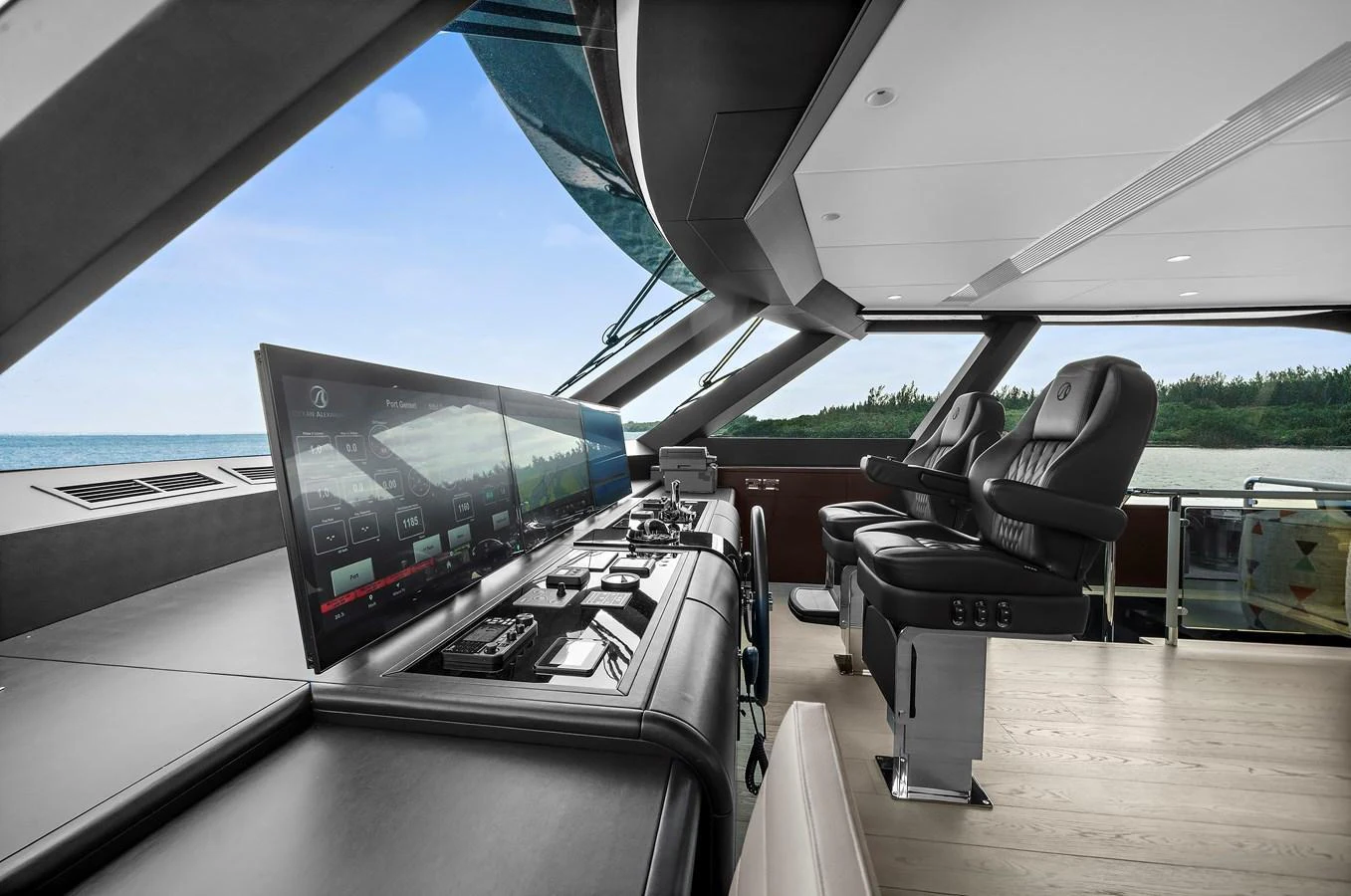 The helm station features state-of-the-art navigation equipment and luxurious seating with a panoramic view. aboard LA LA LA Yacht for Sale