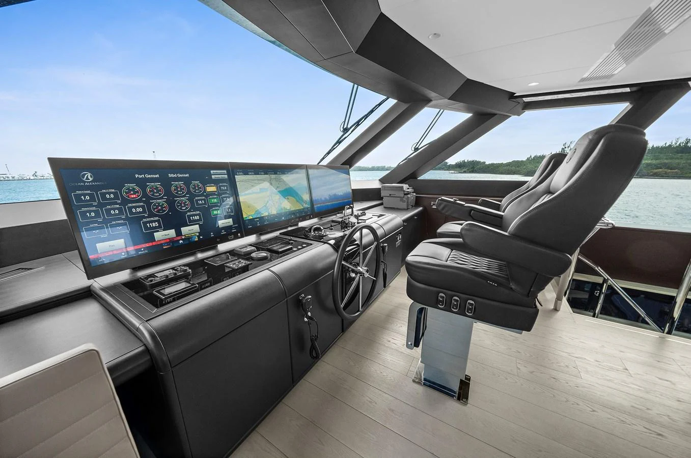 The helm station features advanced navigation equipment and luxurious seating with a panoramic view. aboard LA LA LA Yacht for Sale