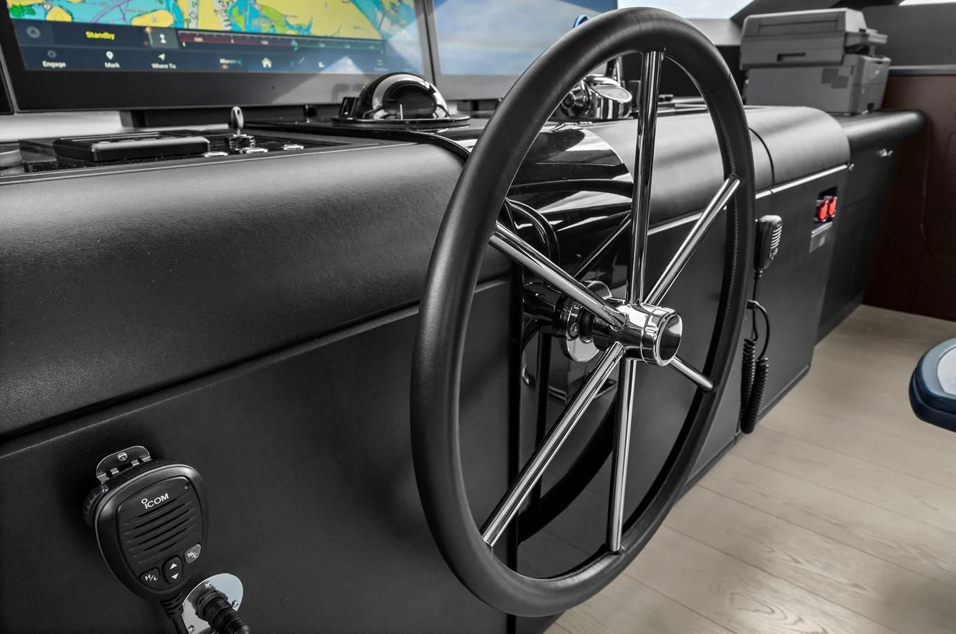 The helm station features a sleek steering wheel and advanced navigation equipment. aboard LA LA LA Yacht for Sale