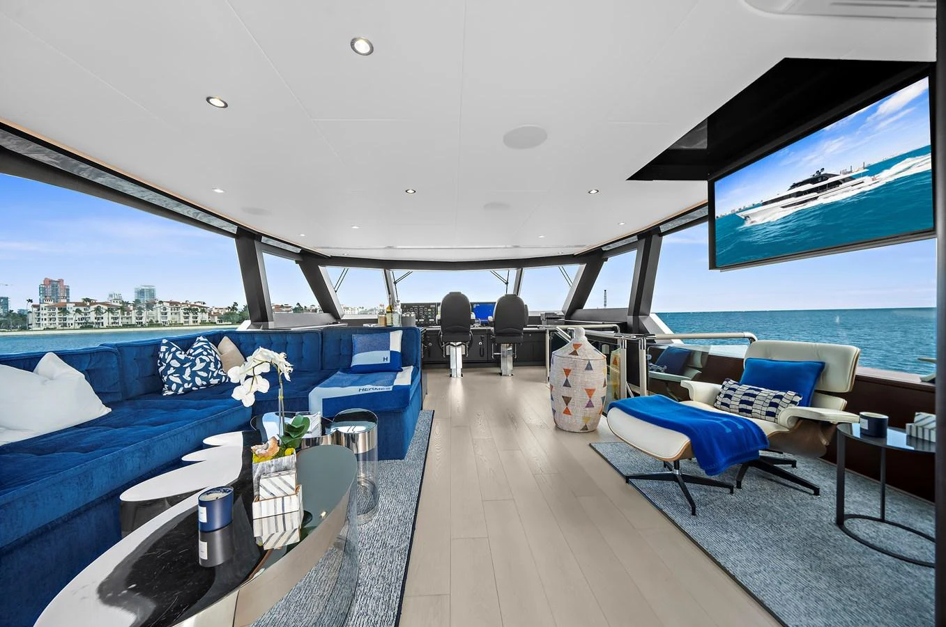 The salon offers a spacious and luxurious seating area with panoramic views of the sea. aboard LA LA LA Yacht for Sale