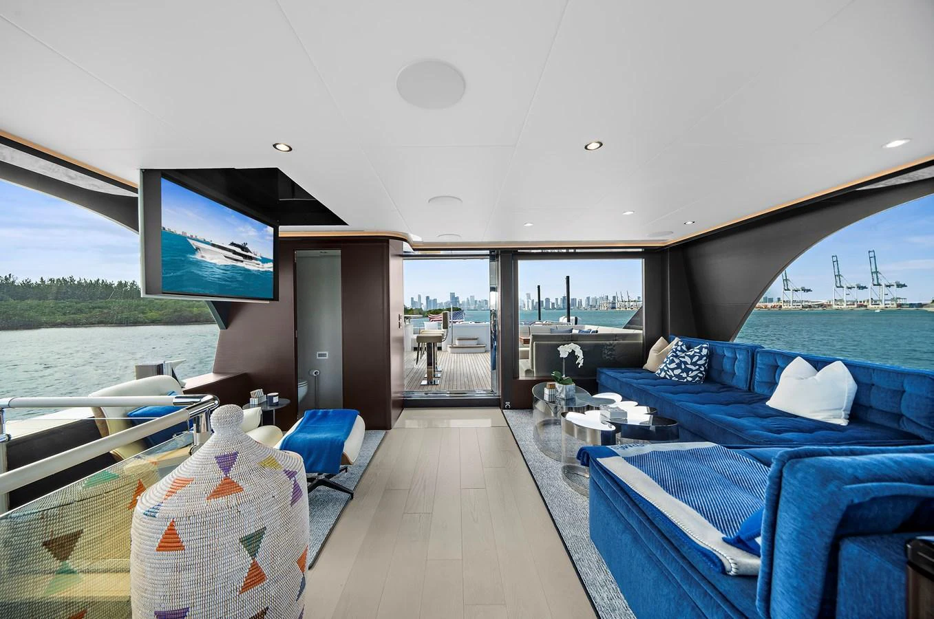The luxurious salon features a spacious seating area with panoramic views and modern decor. aboard LA LA LA Yacht for Sale