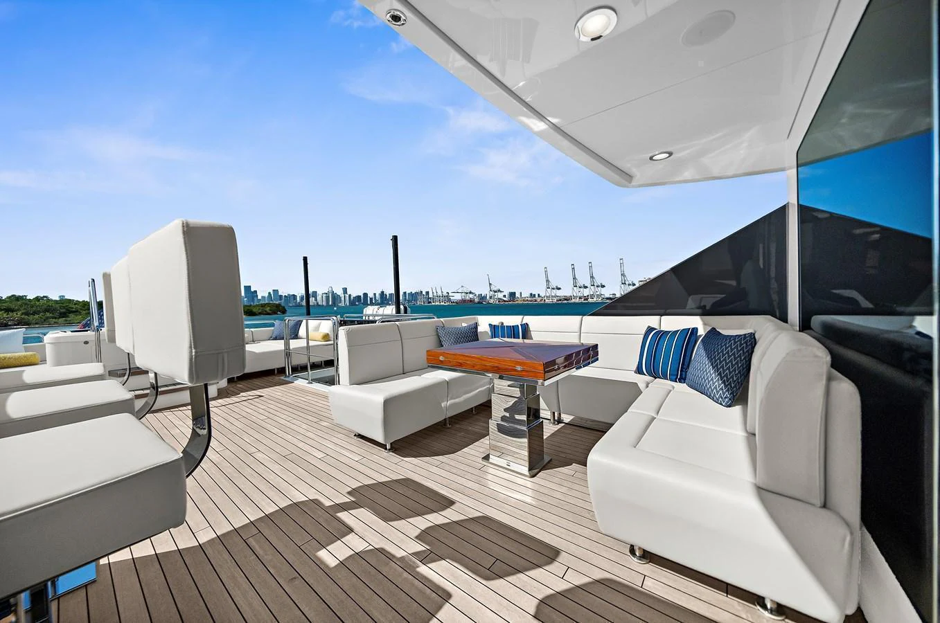 The sundeck offers a spacious and stylish area for relaxation with comfortable seating and scenic views. aboard LA LA LA Yacht for Sale