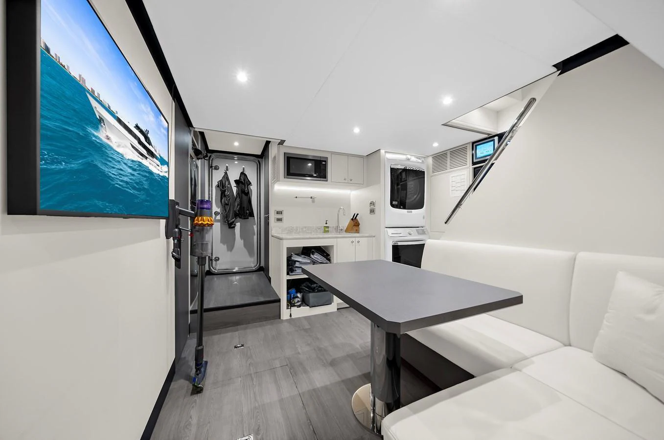 The yacht's interior features a modern and sleek design with a comfortable seating area and a well-equipped galley. aboard LA LA LA Yacht for Sale