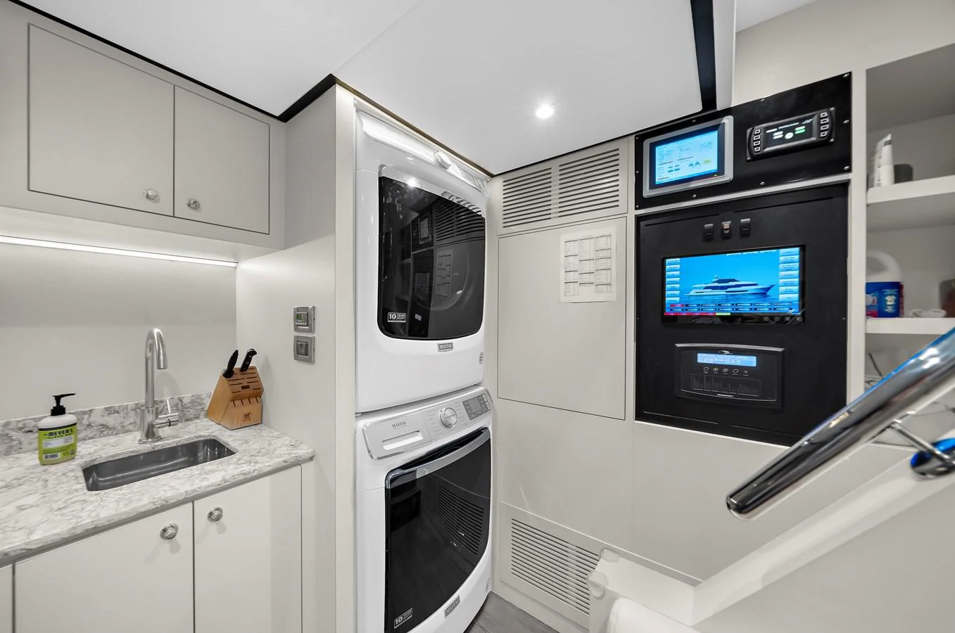 The yacht's laundry room is equipped with modern appliances and ample storage space. aboard LA LA LA Yacht for Sale